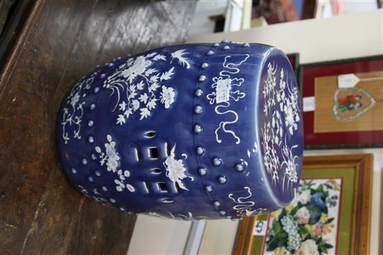 A Chinese blue ground white slip decorated barrel shaped garden seat, late 19th century, 46.5cm